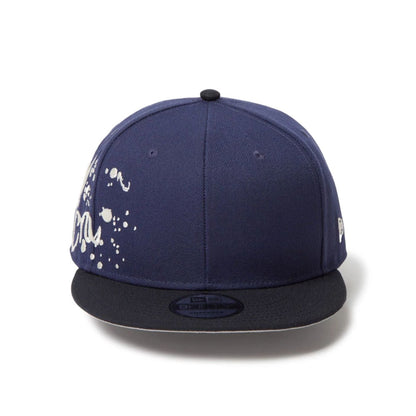 This is a New Era Dripping Emblem Navy 9FIFTY Snapback Adjustable Cap 2