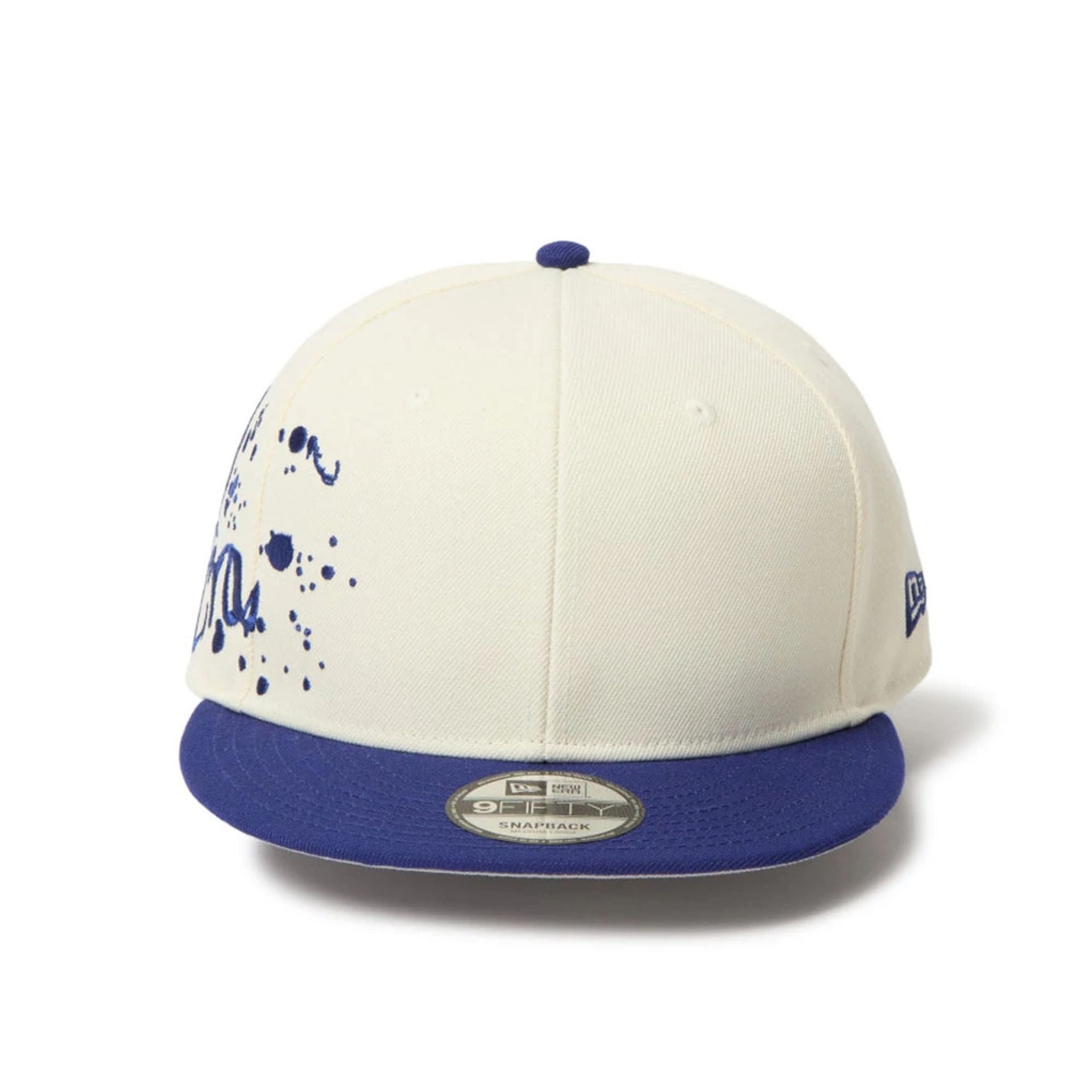 This is a New Era Dripping Emblem Cream 9FIFTY Snapback Adjustable Cap 2