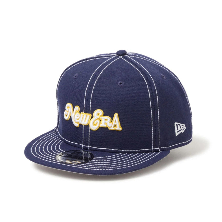 This is a New Era Archive Mix Logo Navy 9FIFTY Snapback Adjustable Cap 1