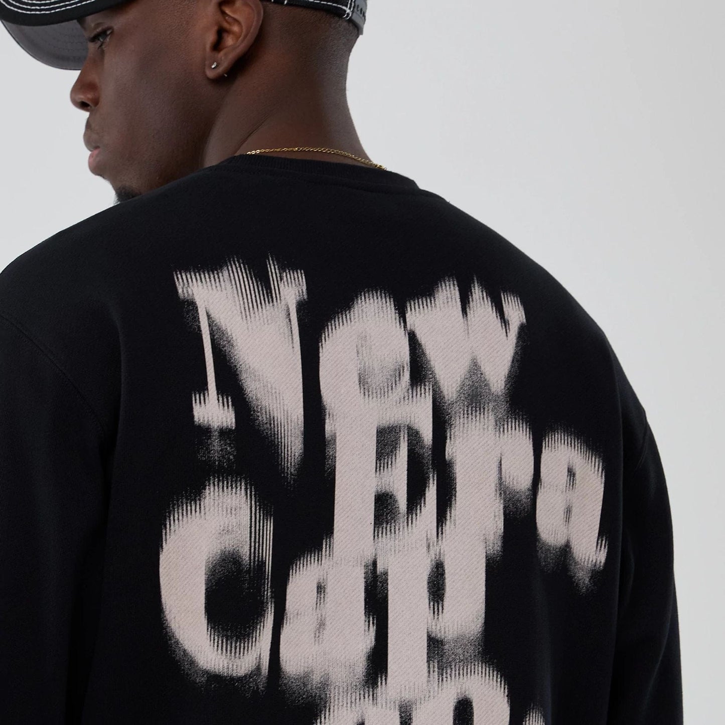 The Male model is wearing New Era Cap Company Black Crew Neck Sweater 4