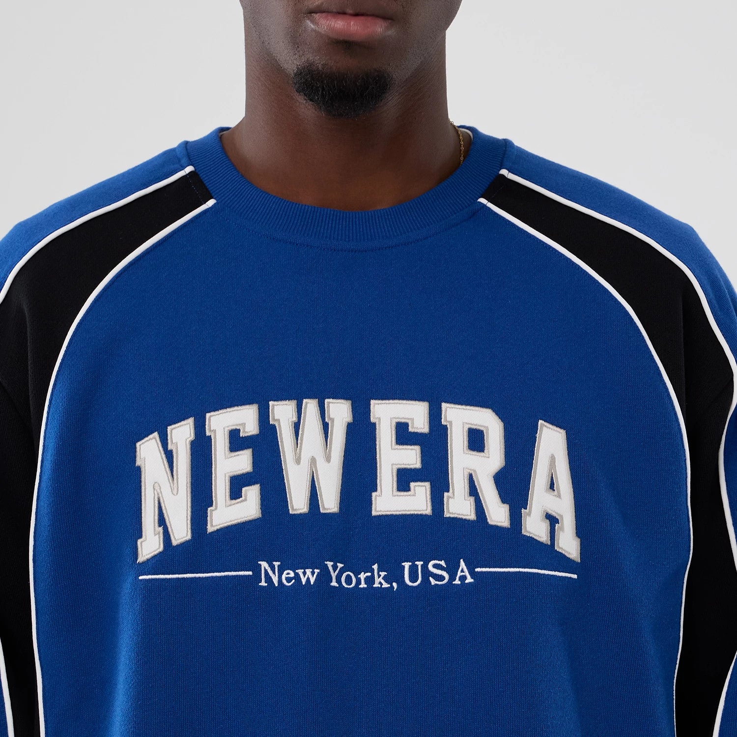 The Male model is wearing New Era Colour Block Navy Crew Neck Sweater 3
