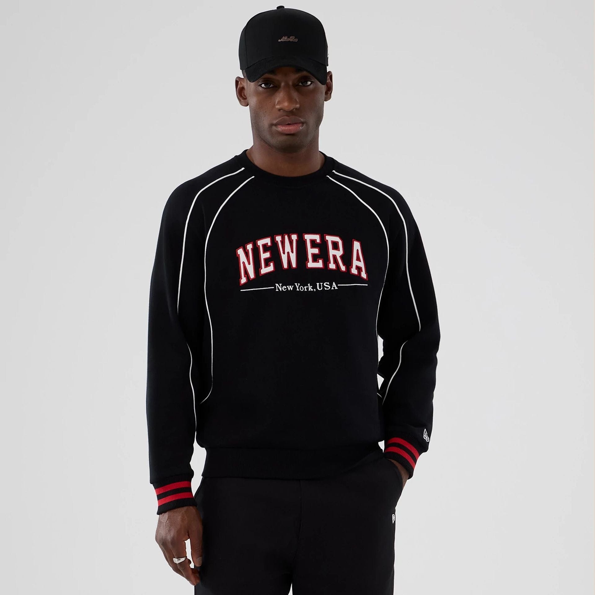 The Male model is wearing New Era Colour Block Black Crew Neck Sweater 1