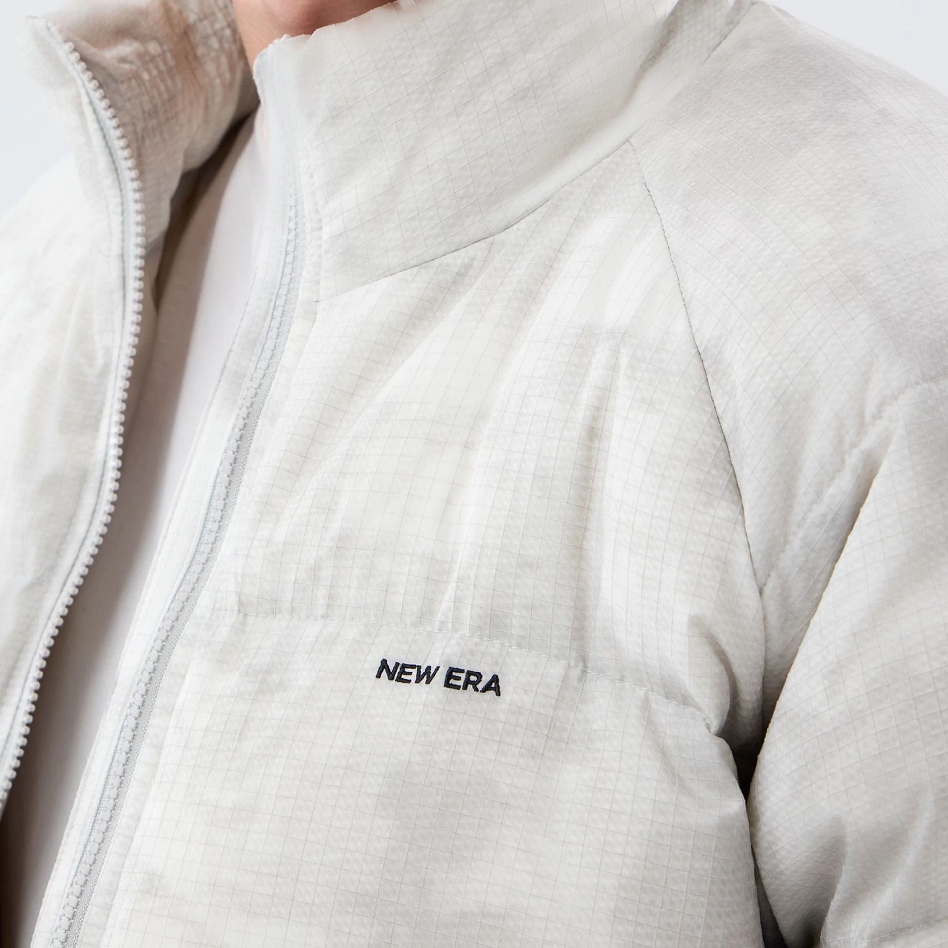 The Male model is wearing  New Era Outdoor Natural Down Jacket  7