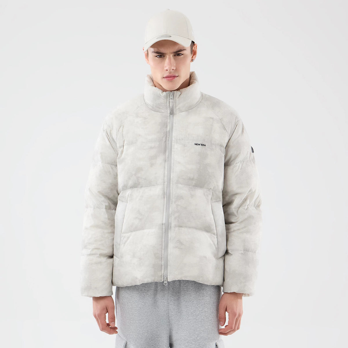 The Male model is wearing  New Era Outdoor Natural Down Jacket 1