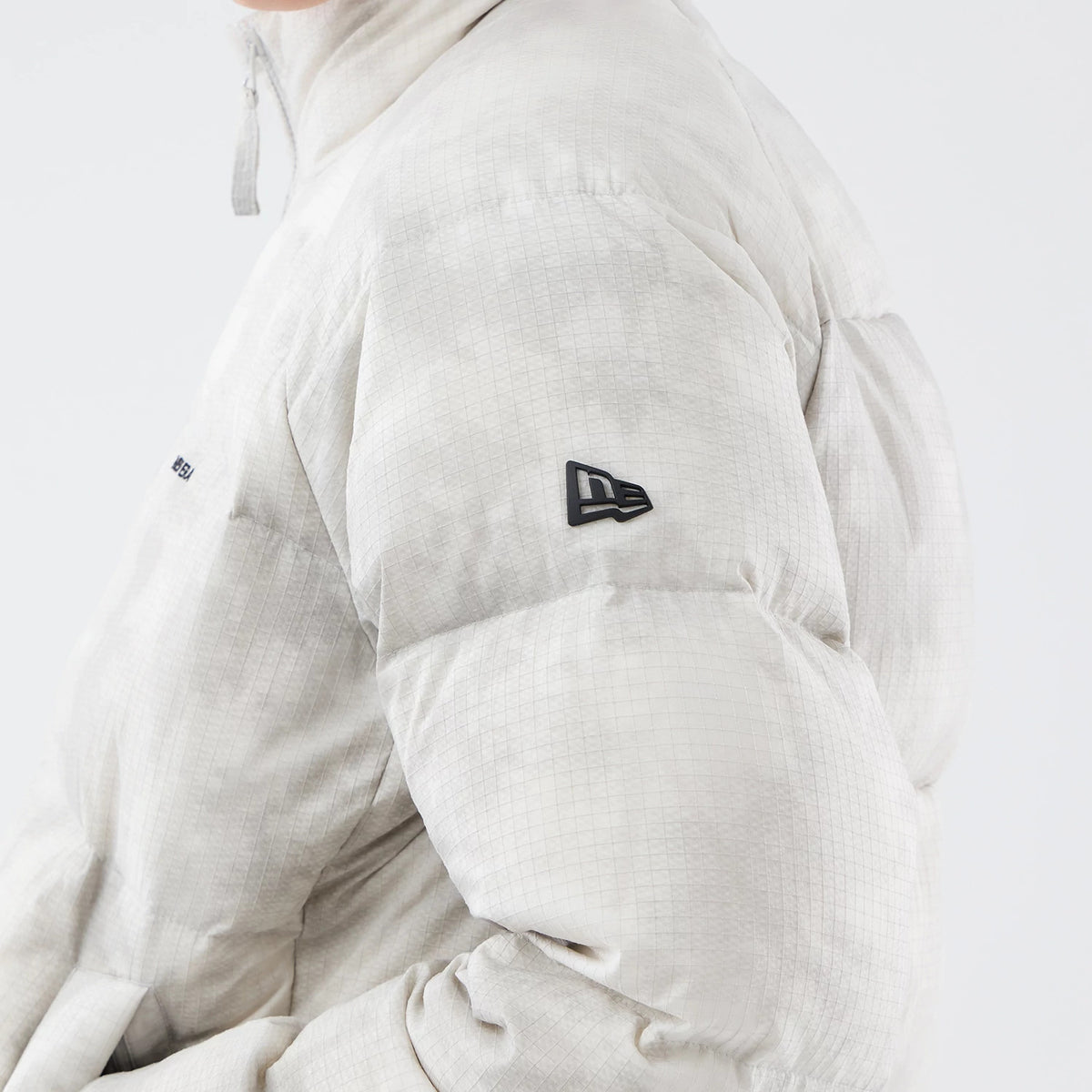 The Male model is wearing  New Era Outdoor Natural Down Jacket 5