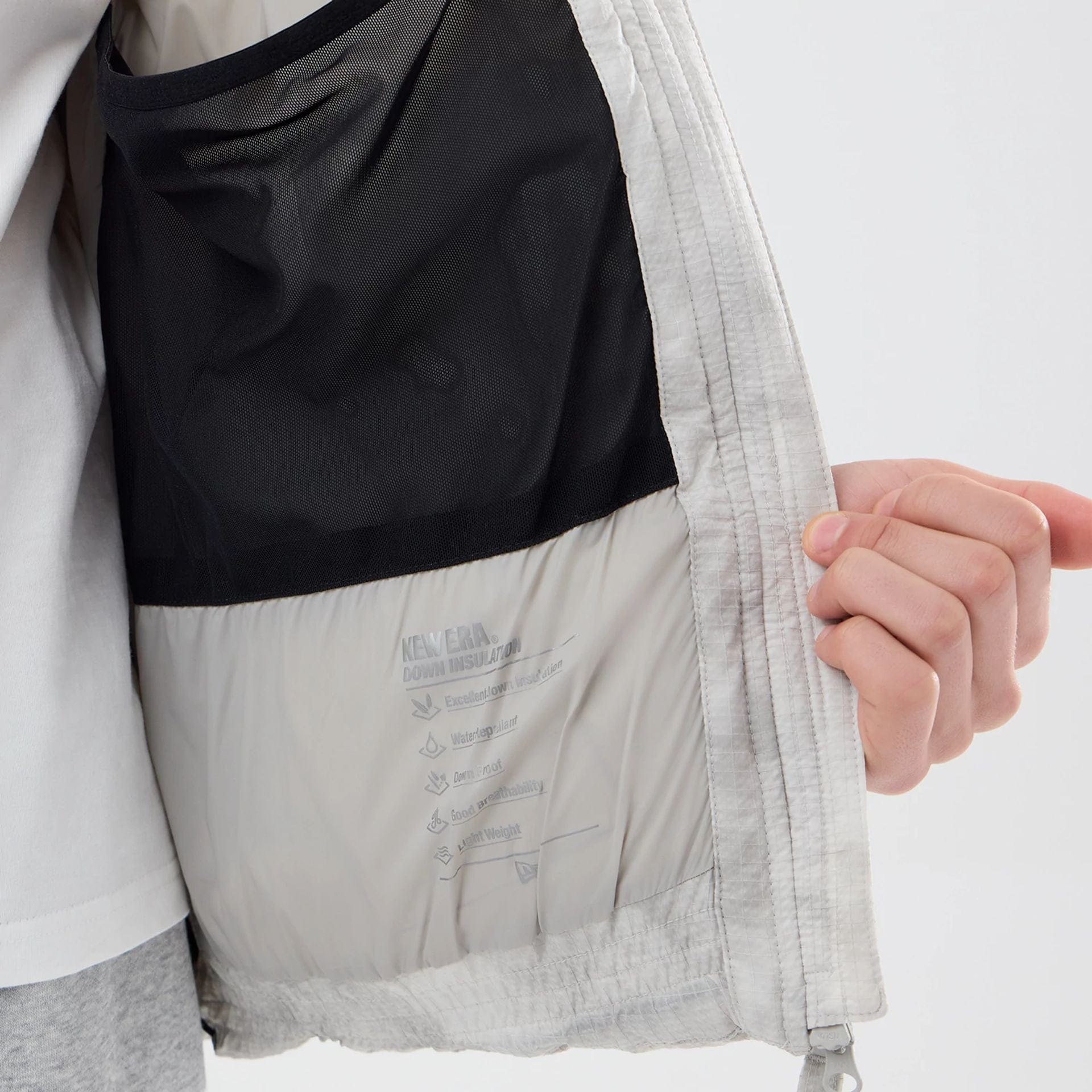 The Male model is wearing  New Era Outdoor Natural Down Jacket  3