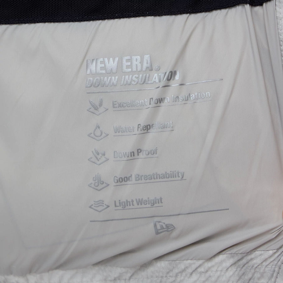 The Male model is wearing  New Era Outdoor Natural Down Jacket  4