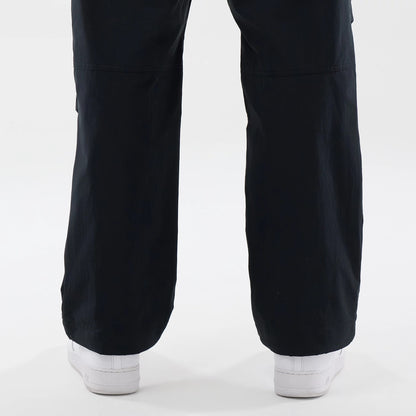 The Male model is wearing New Era Organic Black Parachute Trousers 7