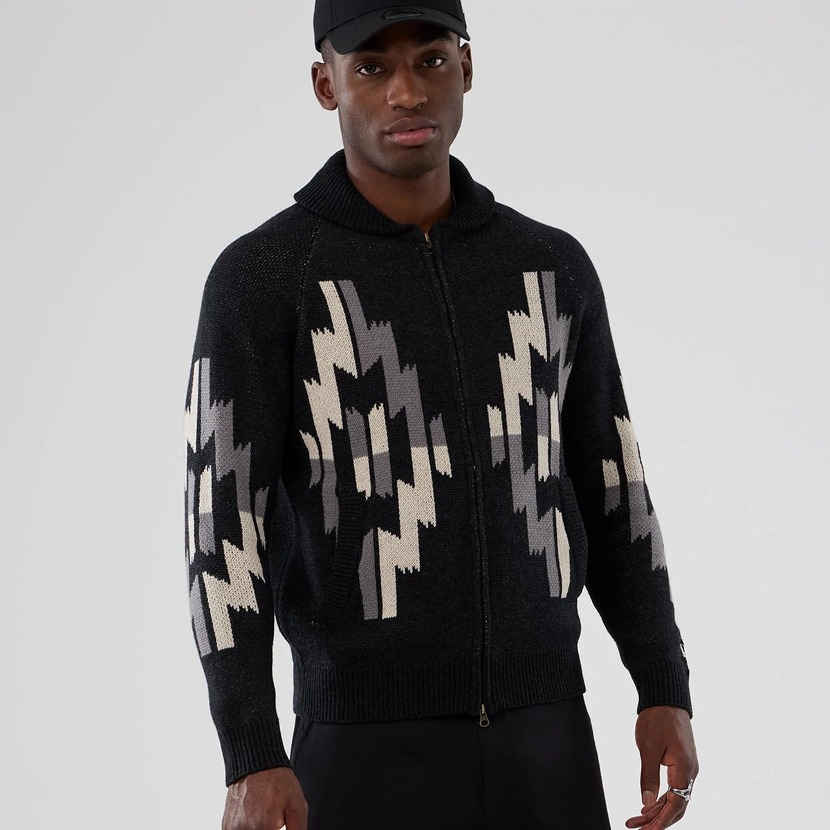 The Male model is wearing  New Era Organic Cowichan Black Cardigan 7