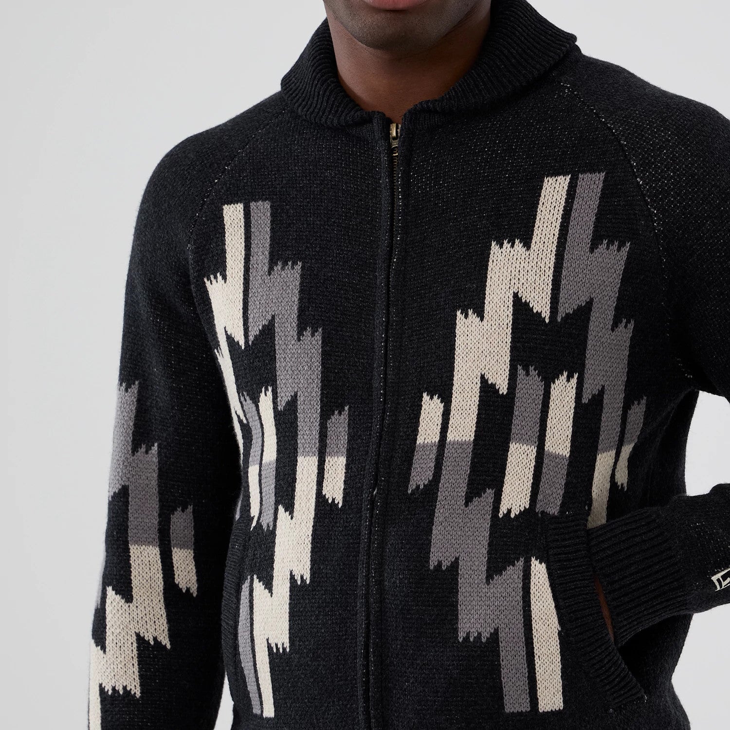 The Male model is wearing  New Era Organic Cowichan Black Cardigan 3