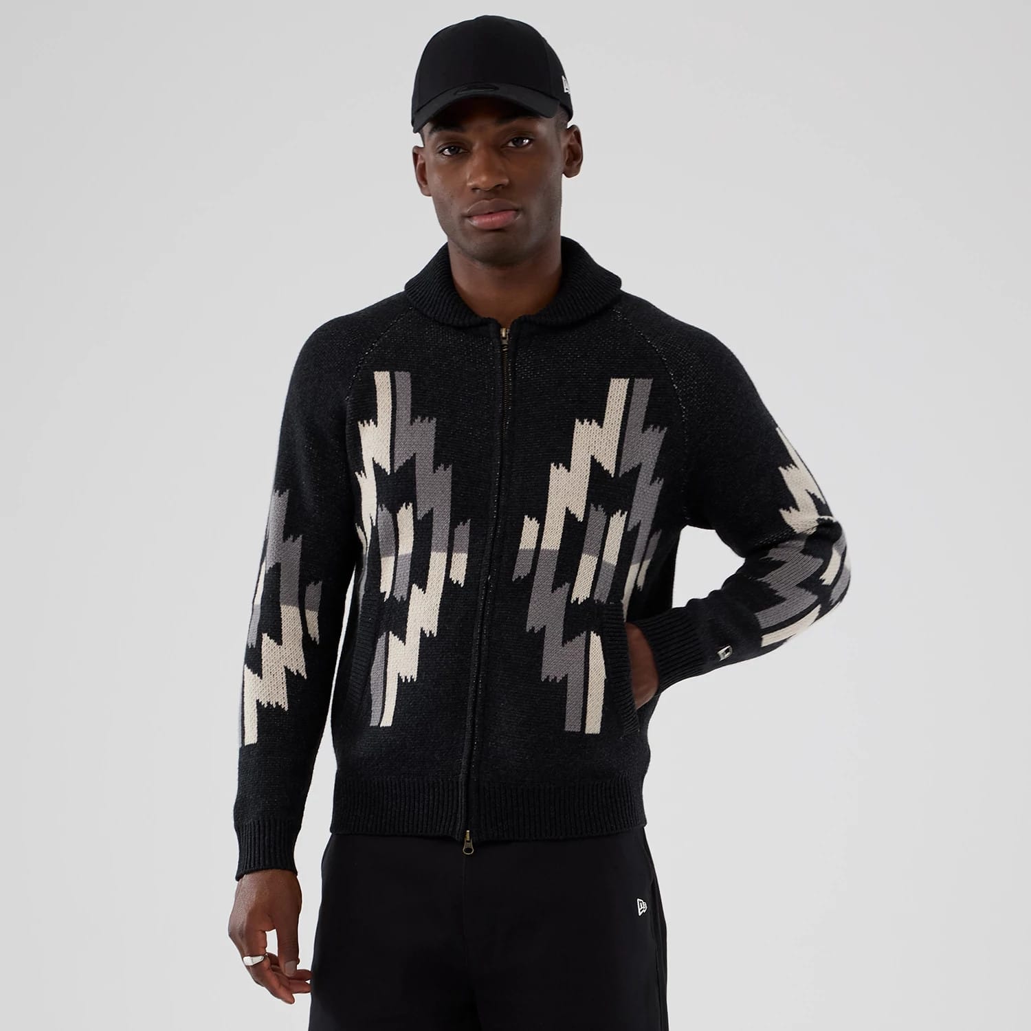The Male model is wearing  New Era Organic Cowichan Black Cardigan 1
