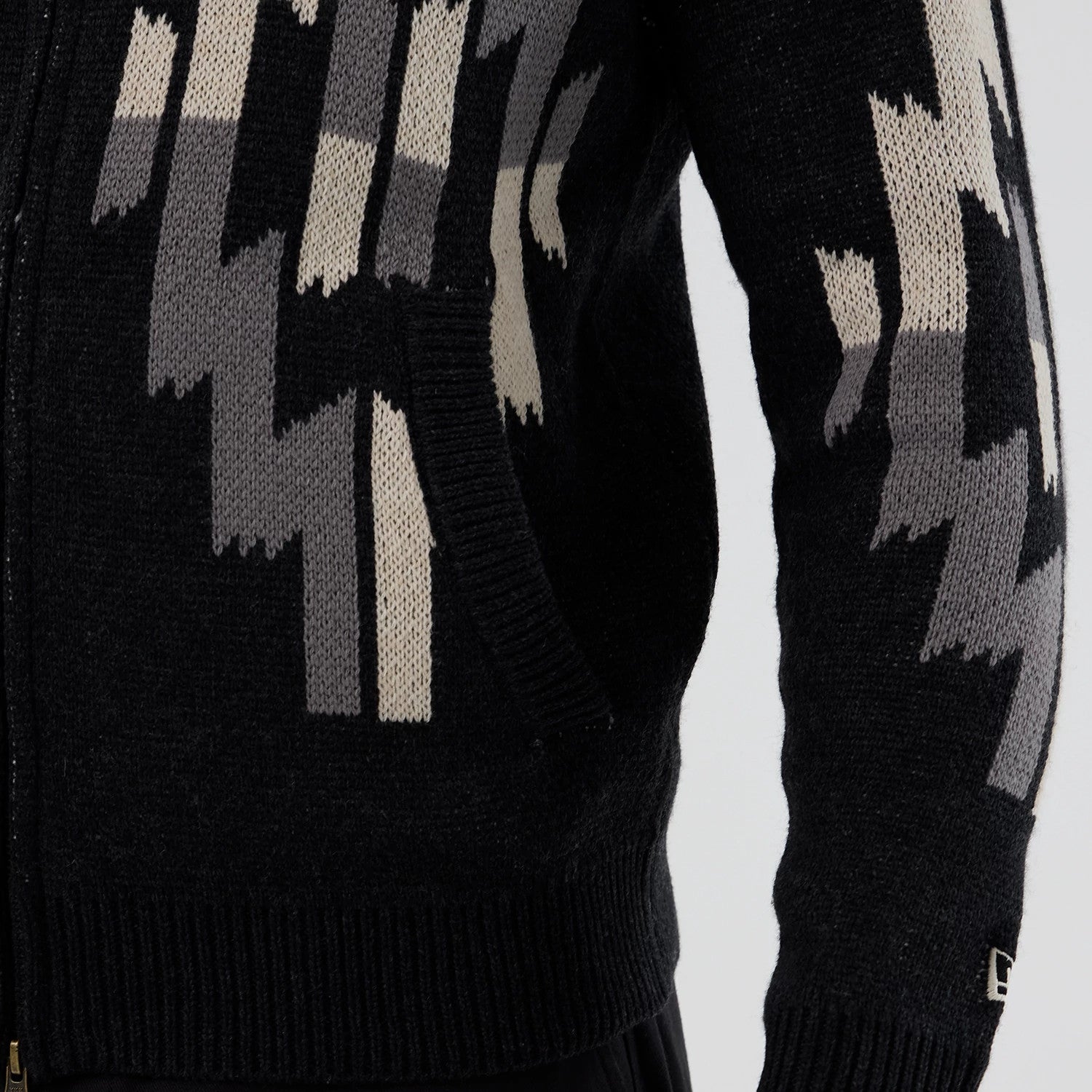 The Male model is wearing  New Era Organic Cowichan Black Cardigan 5