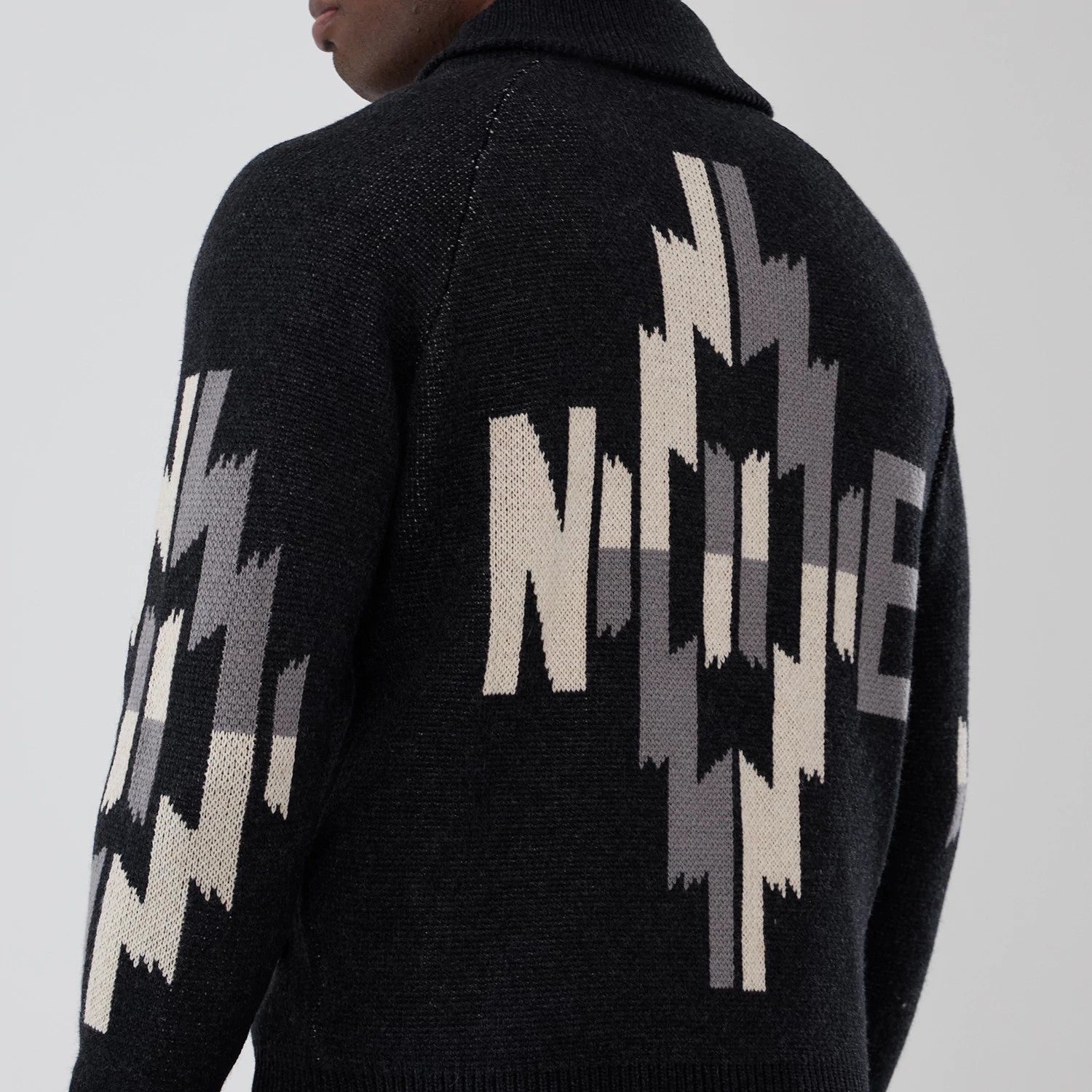 The Male model is wearing  New Era Organic Cowichan Black Cardigan 6
