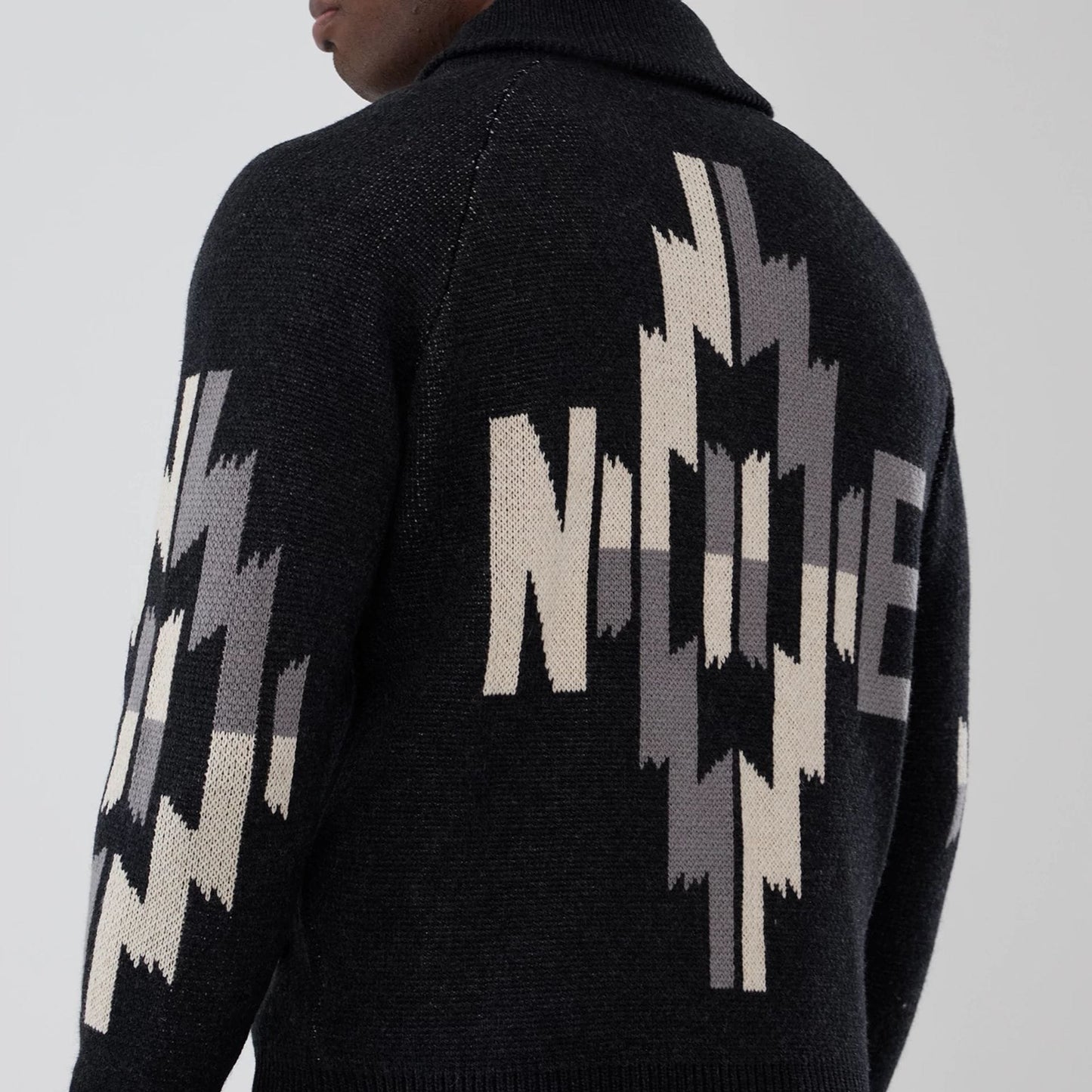 The Male model is wearing  New Era Organic Cowichan Black Cardigan 6