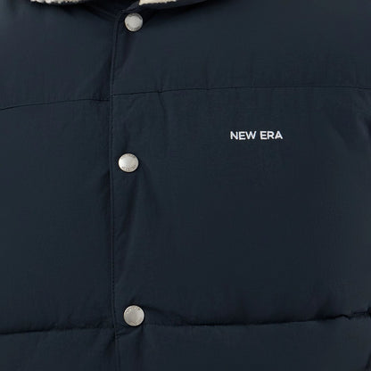 The Male model is wearing  New Era Organic Boa Neck Navy Gilet  6