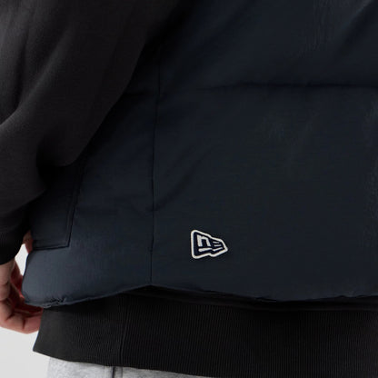 The Male model is wearing  New Era Organic Boa Neck Navy Gilet 7