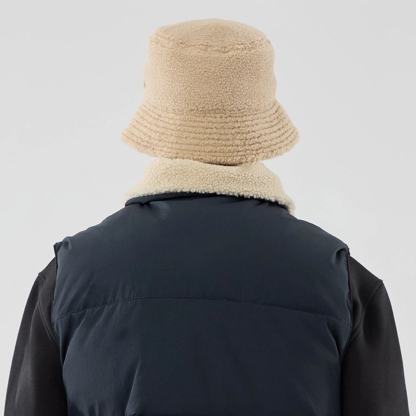 The Male model is wearing  New Era Organic Boa Neck Navy Gilet  8