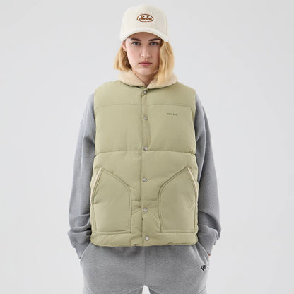 The Male model is wearing  New Era Organic Boa Neck Khaki Gilet 8