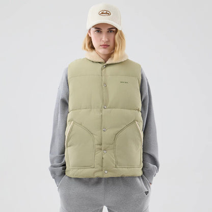The Male model is wearing  New Era Organic Boa Neck Khaki Gilet 8
