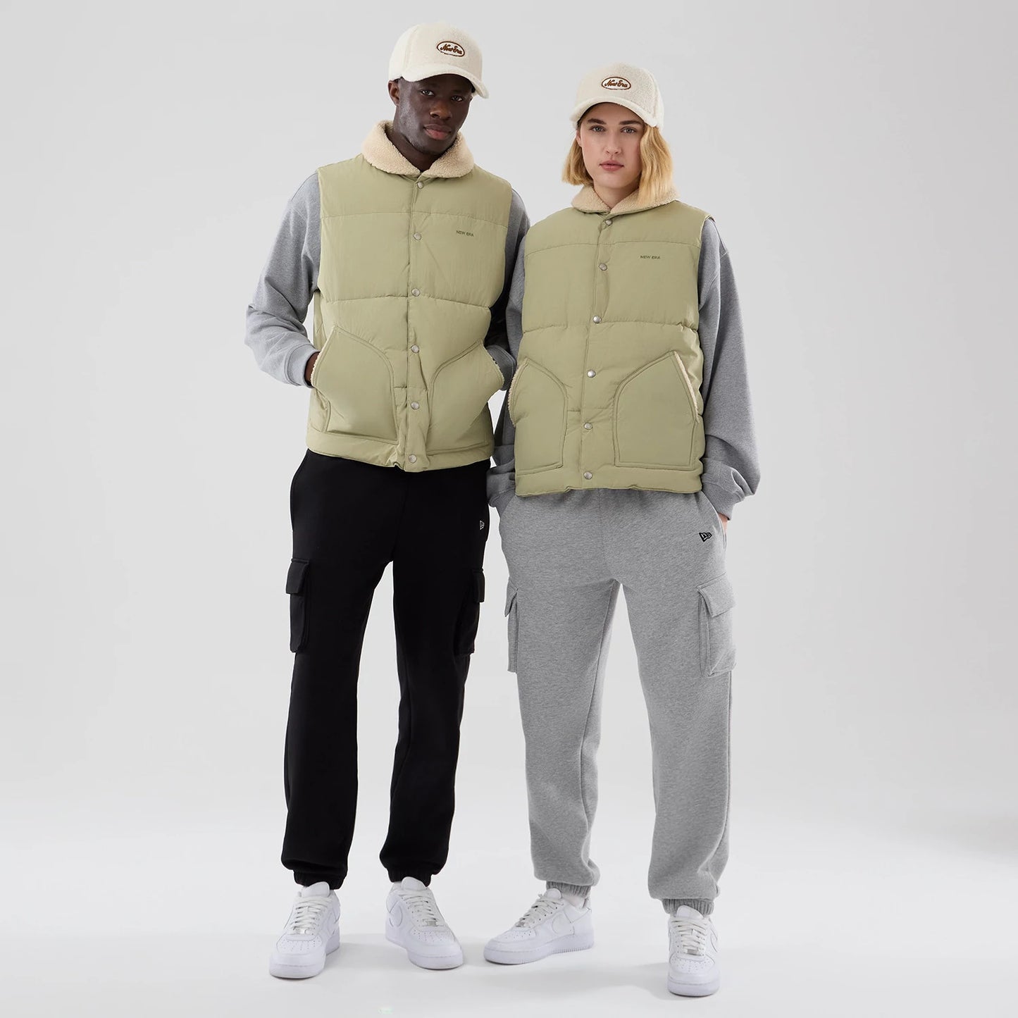The Male model is wearing  New Era Organic Boa Neck Khaki Gilet 1