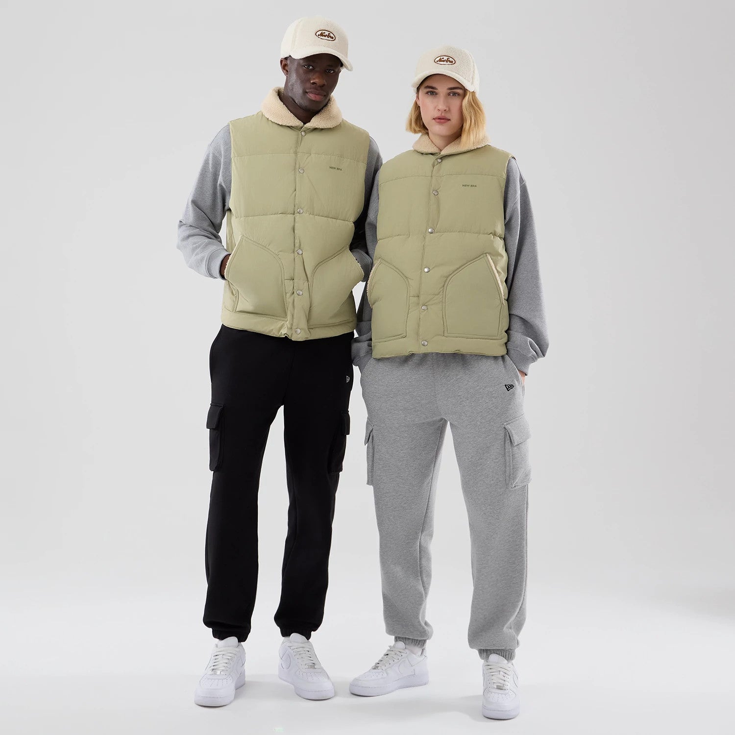 The Male model is wearing  New Era Organic Boa Neck Khaki Gilet 1