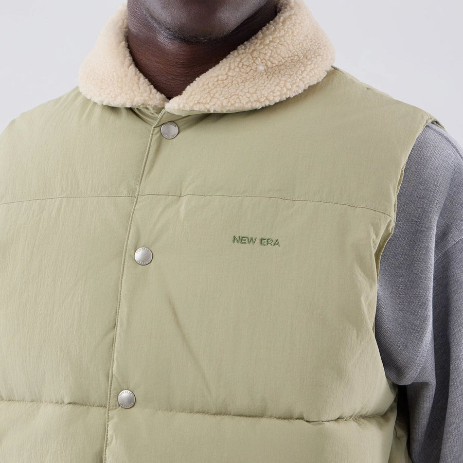 The Male model is wearing  New Era Organic Boa Neck Khaki Gilet  4
