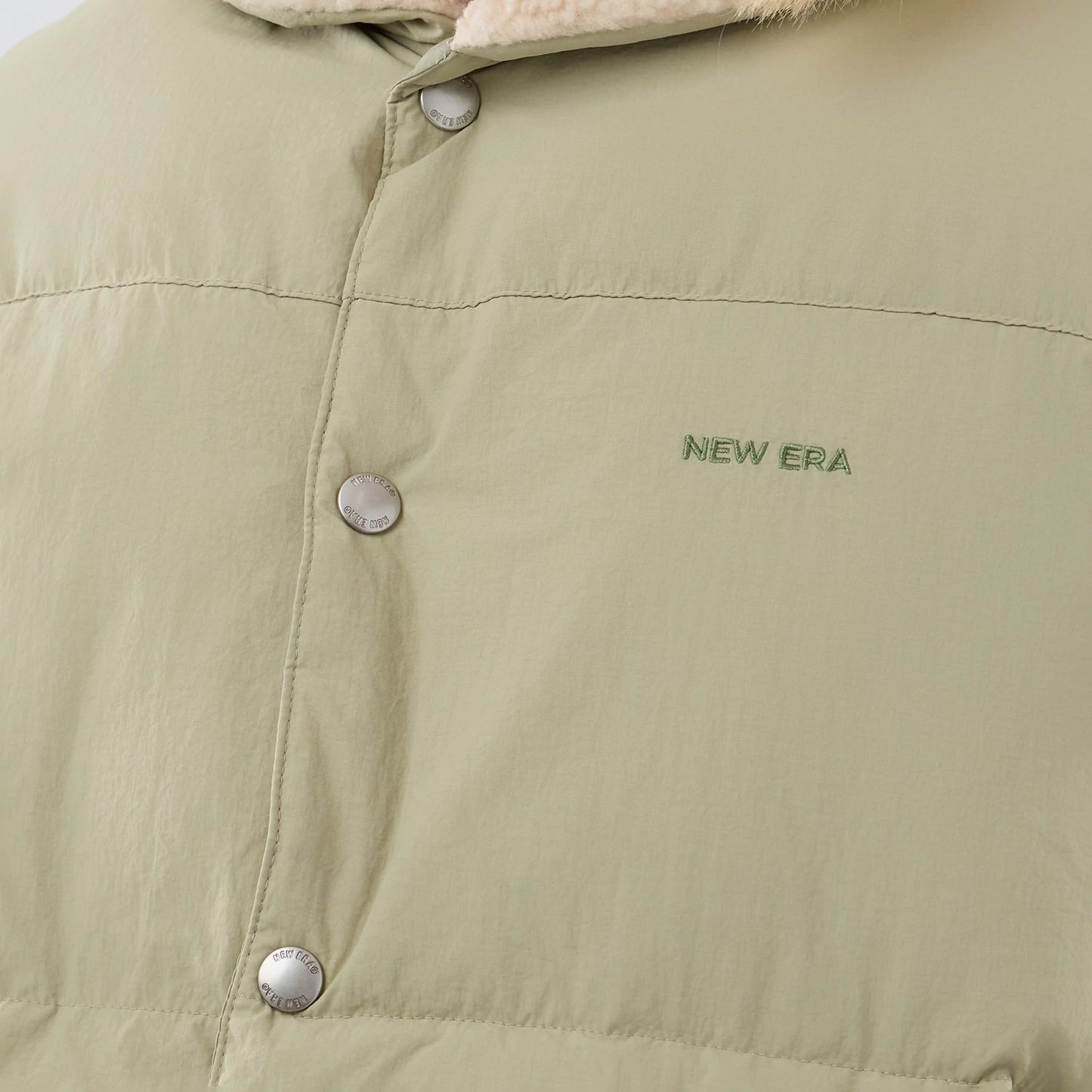 The Male model is wearing  New Era Organic Boa Neck Khaki Gilet 5