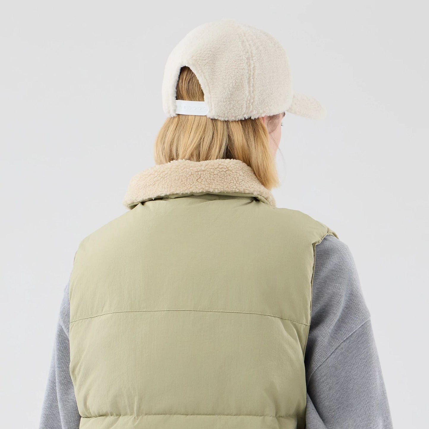 The Male model is wearing  New Era Organic Boa Neck Khaki Gilet  7