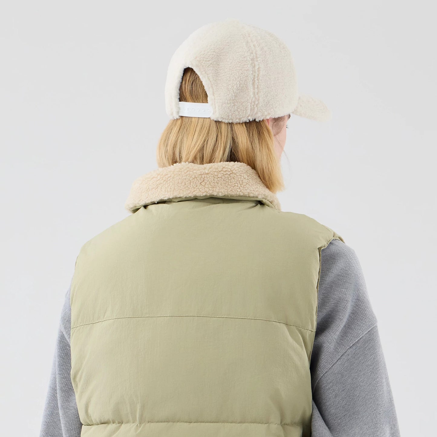 The Male model is wearing  New Era Organic Boa Neck Khaki Gilet 7