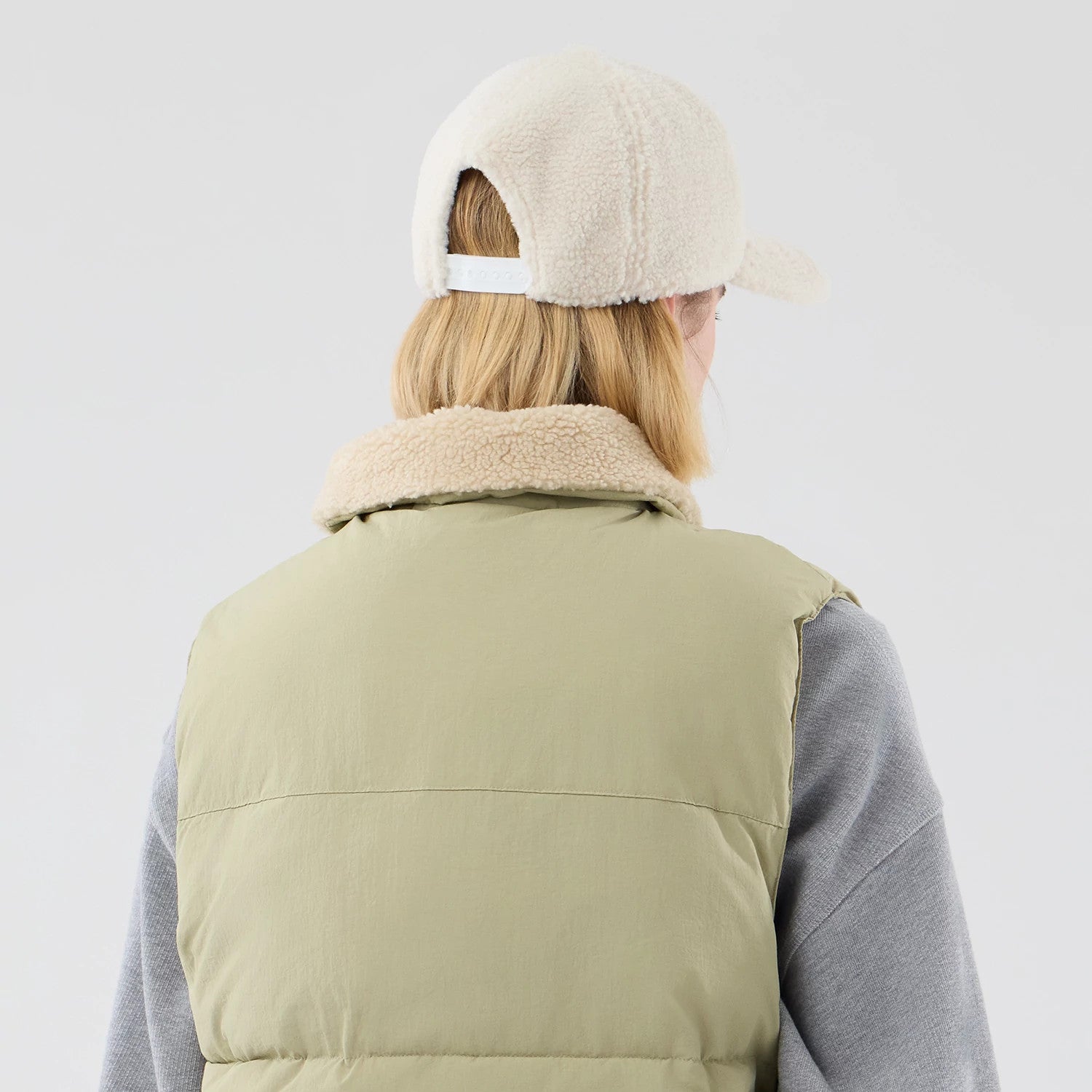 The Male model is wearing  New Era Organic Boa Neck Khaki Gilet 7