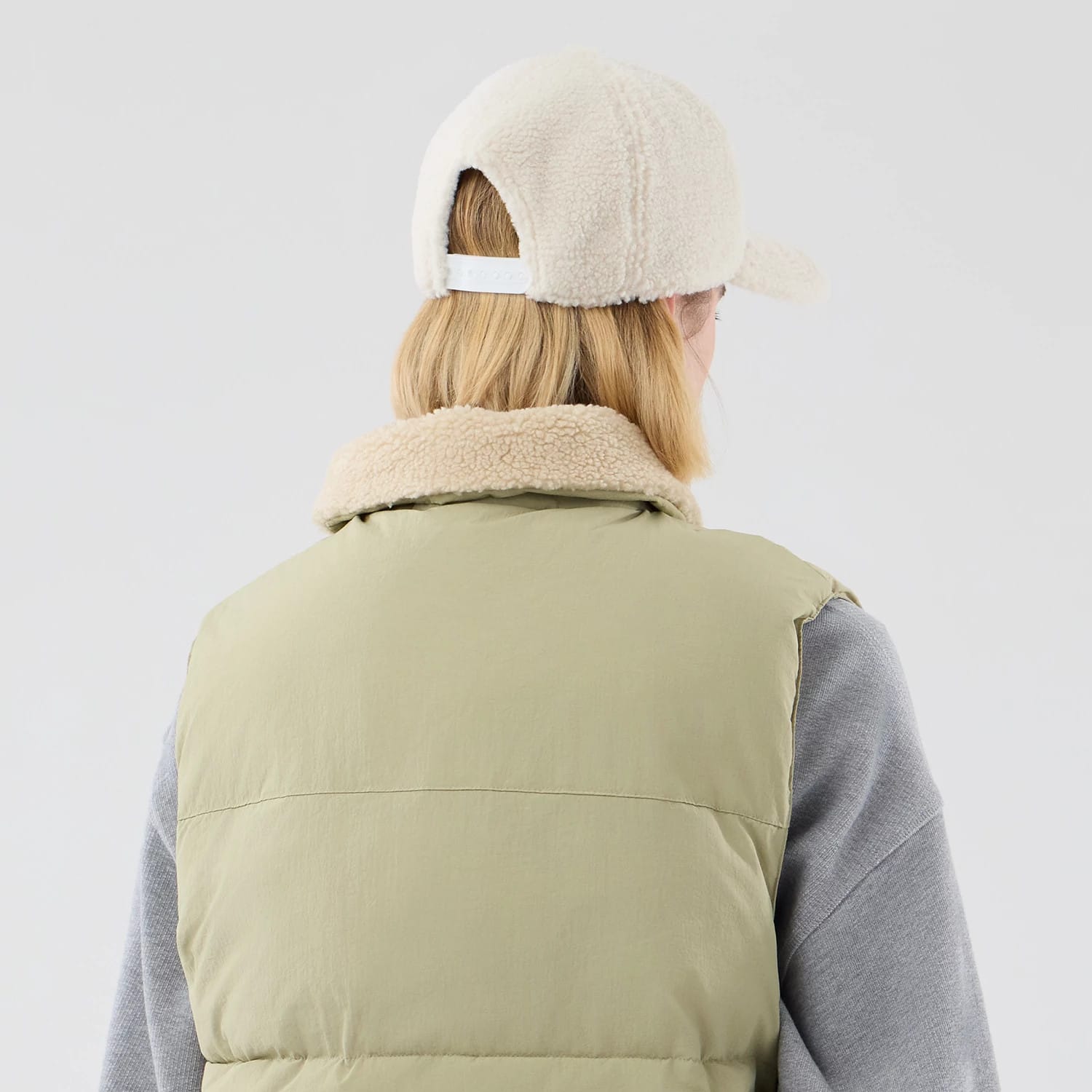 The Male model is wearing  New Era Organic Boa Neck Khaki Gilet 7