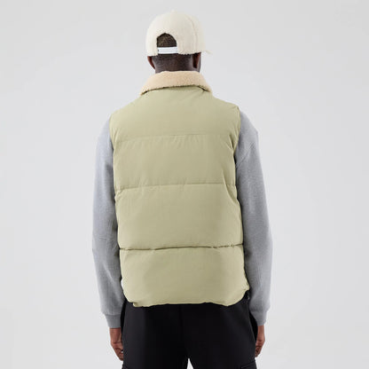 The Male model is wearing  New Era Organic Boa Neck Khaki Gilet 2