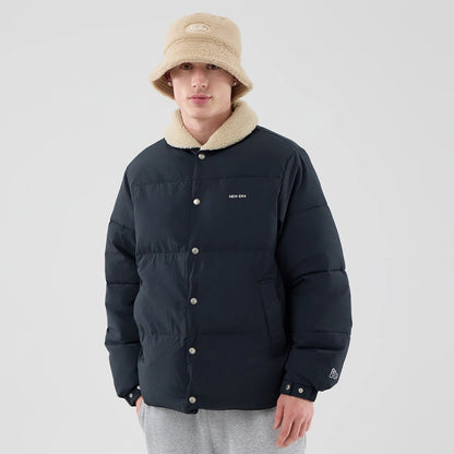 The Male model is wearing  New Era Organic Boa Neck Navy Jacket 3