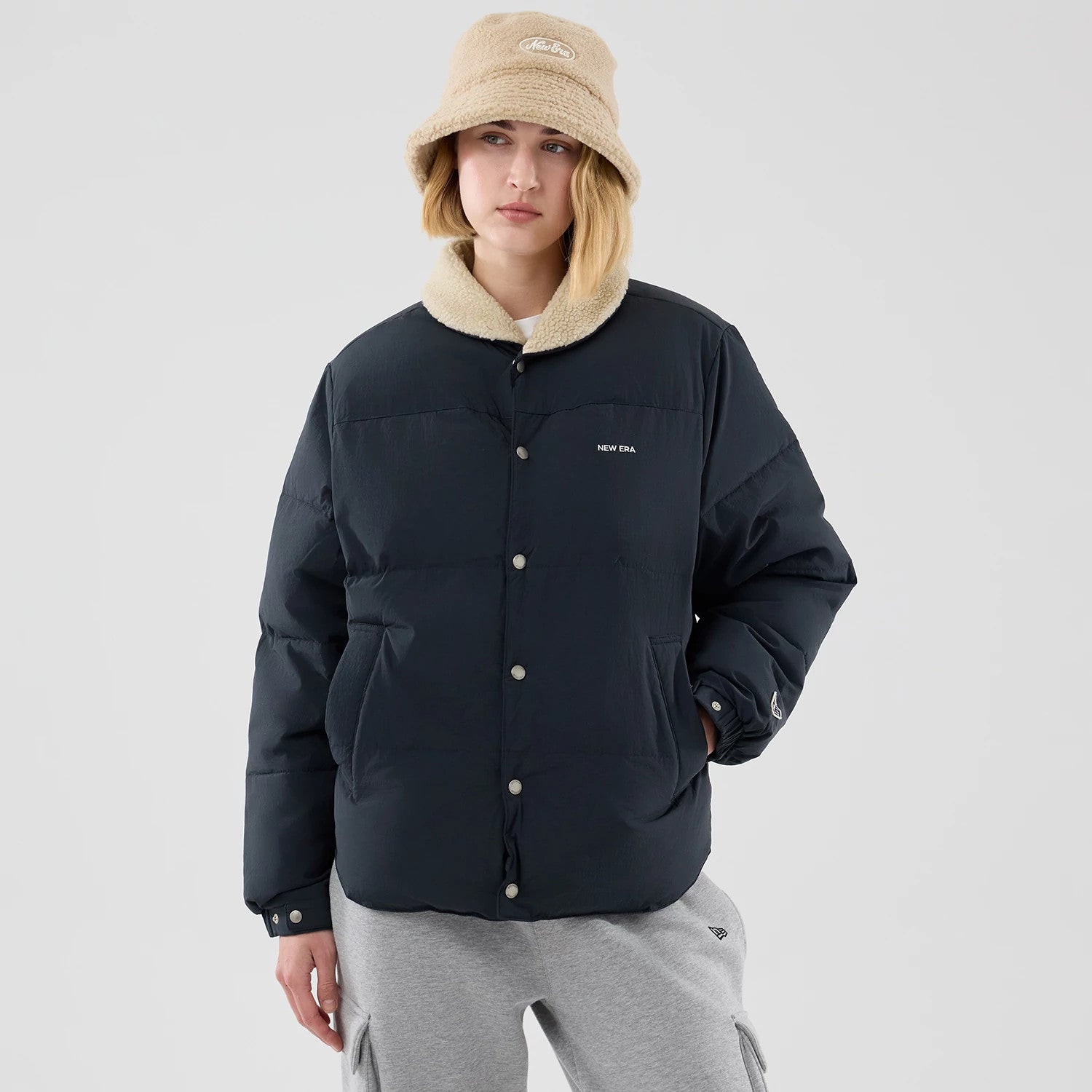 The Male model is wearing  New Era Organic Boa Neck Navy Jacket 4