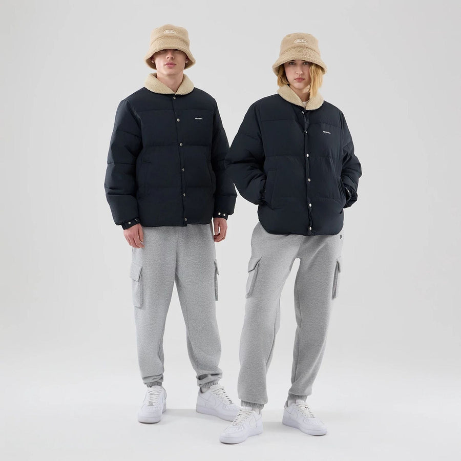 The Male model is wearing  New Era Organic Boa Neck Navy Jacket  1