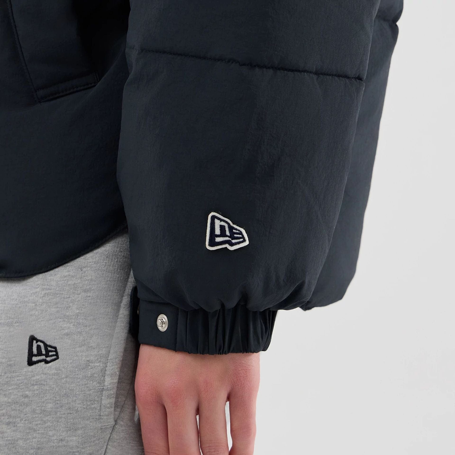 The Male model is wearing  New Era Organic Boa Neck Navy Jacket  7