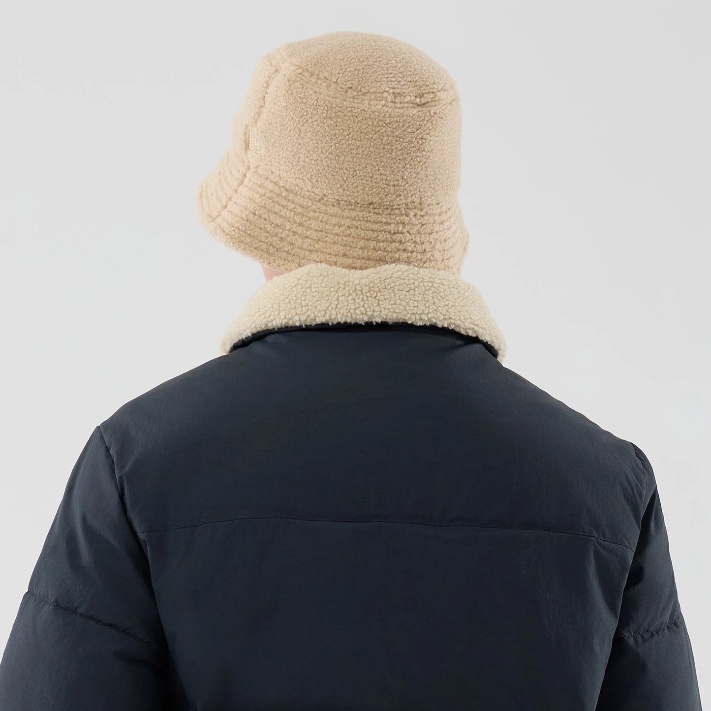 The Male model is wearing  New Era Organic Boa Neck Navy Jacket 8