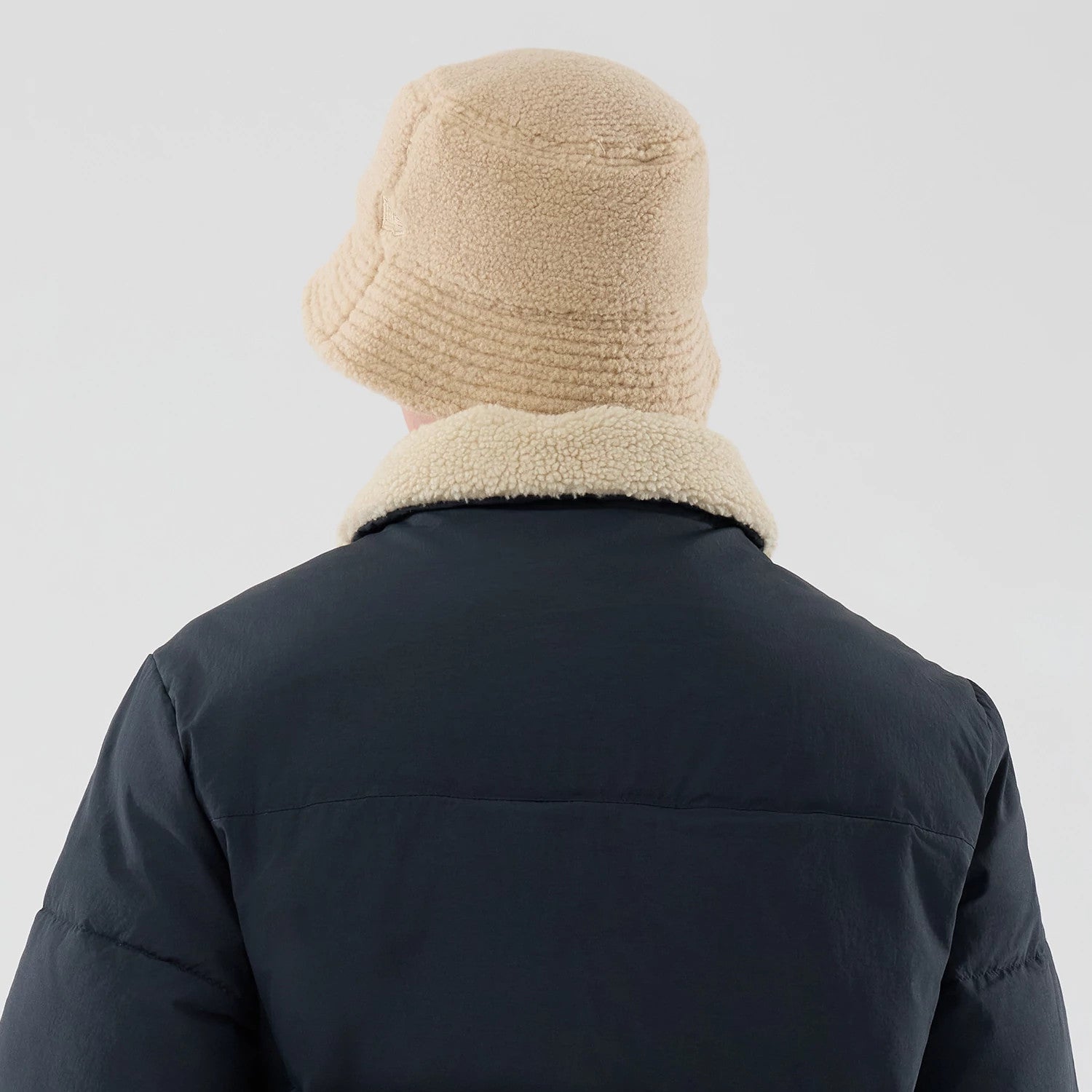 The Male model is wearing  New Era Organic Boa Neck Navy Jacket 8
