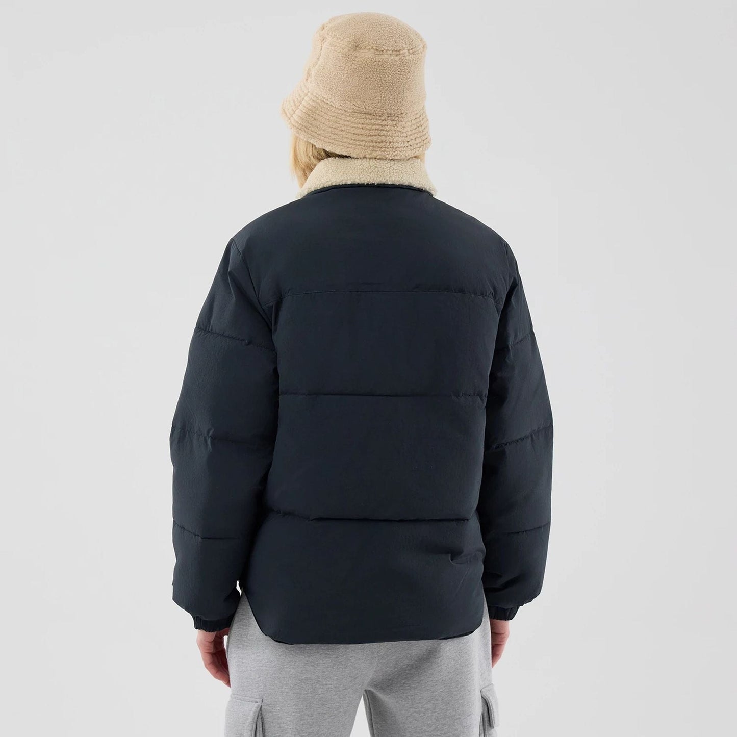 The Male model is wearing  New Era Organic Boa Neck Navy Jacket  2