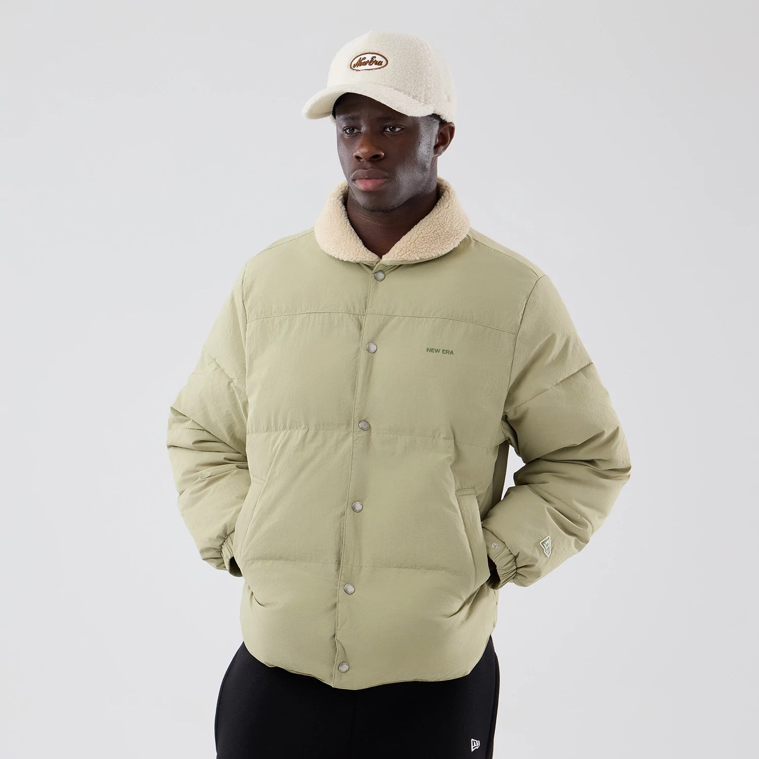 The Male model is wearing  New Era Organic Boa Neck Khaki Jacket 3