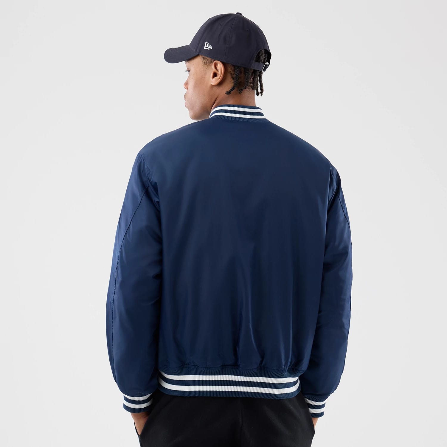 The Male model is wearing New York Yankees MLB Authentic Navy Stadium Jacket 2