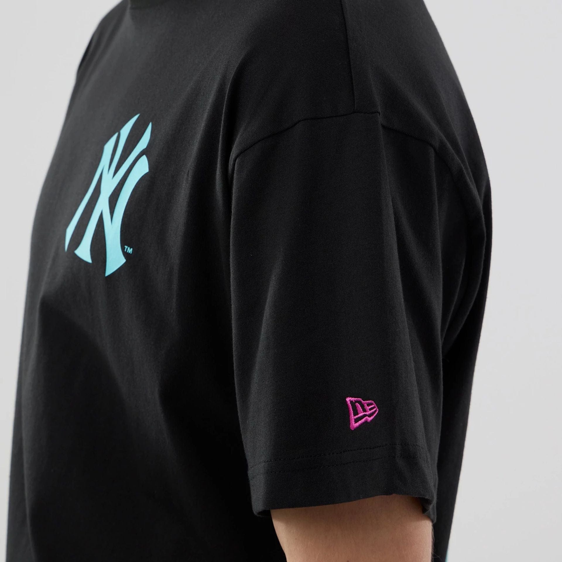The model is wearing this MLB Neon Light New York Yankees T-Shirt in black. 6