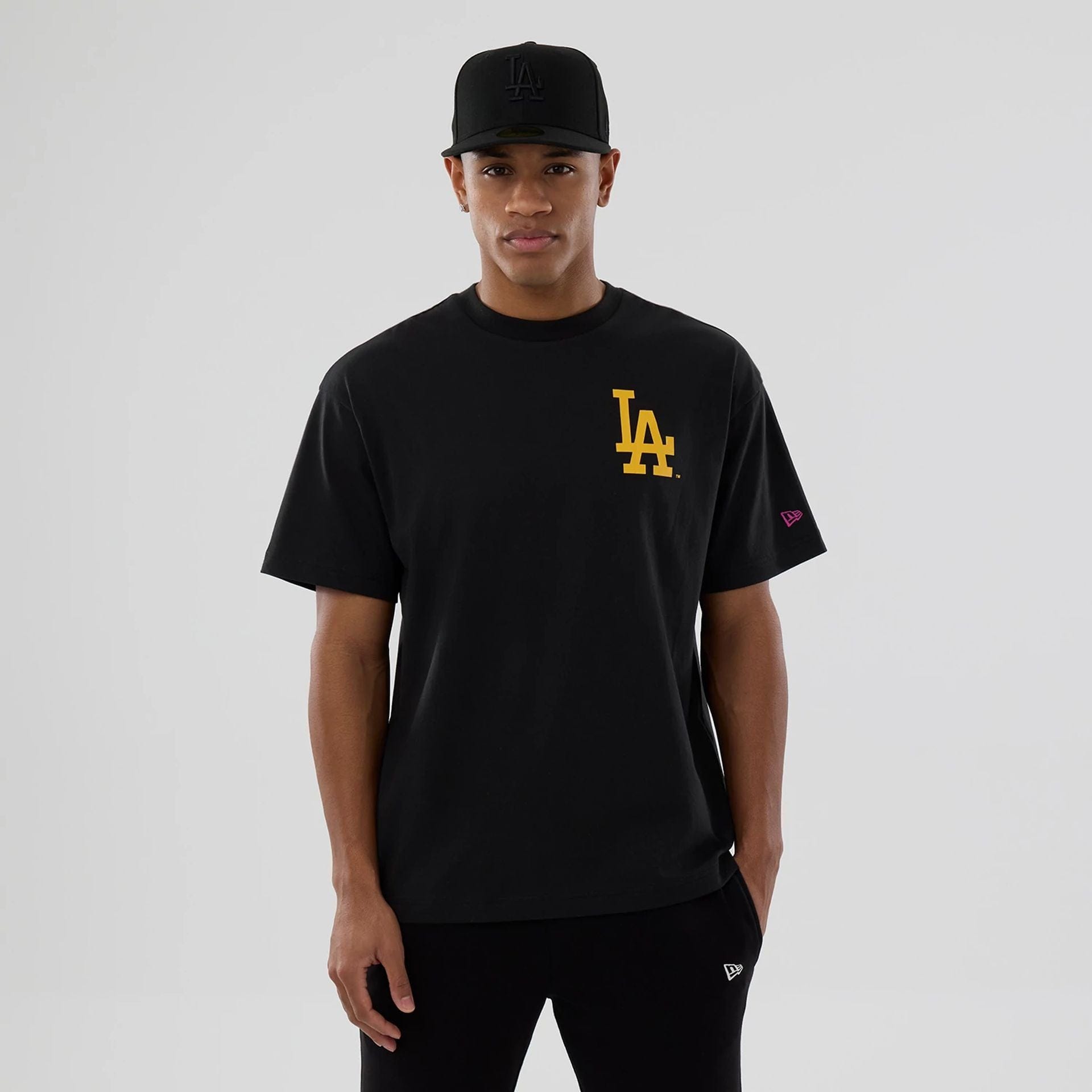 The model is wearing this MLB Neon Light LA Dodgers T-Shirt in black. 6