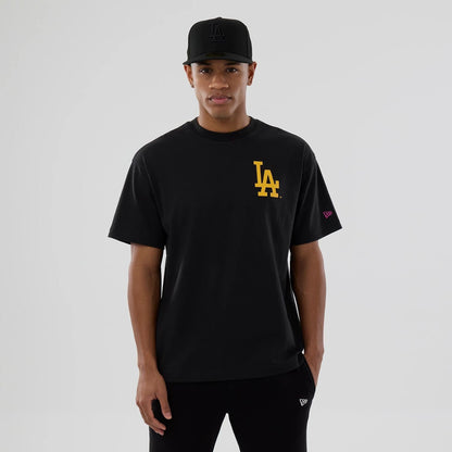 The model is wearing this MLB Neon Light LA Dodgers T-Shirt in black. 6