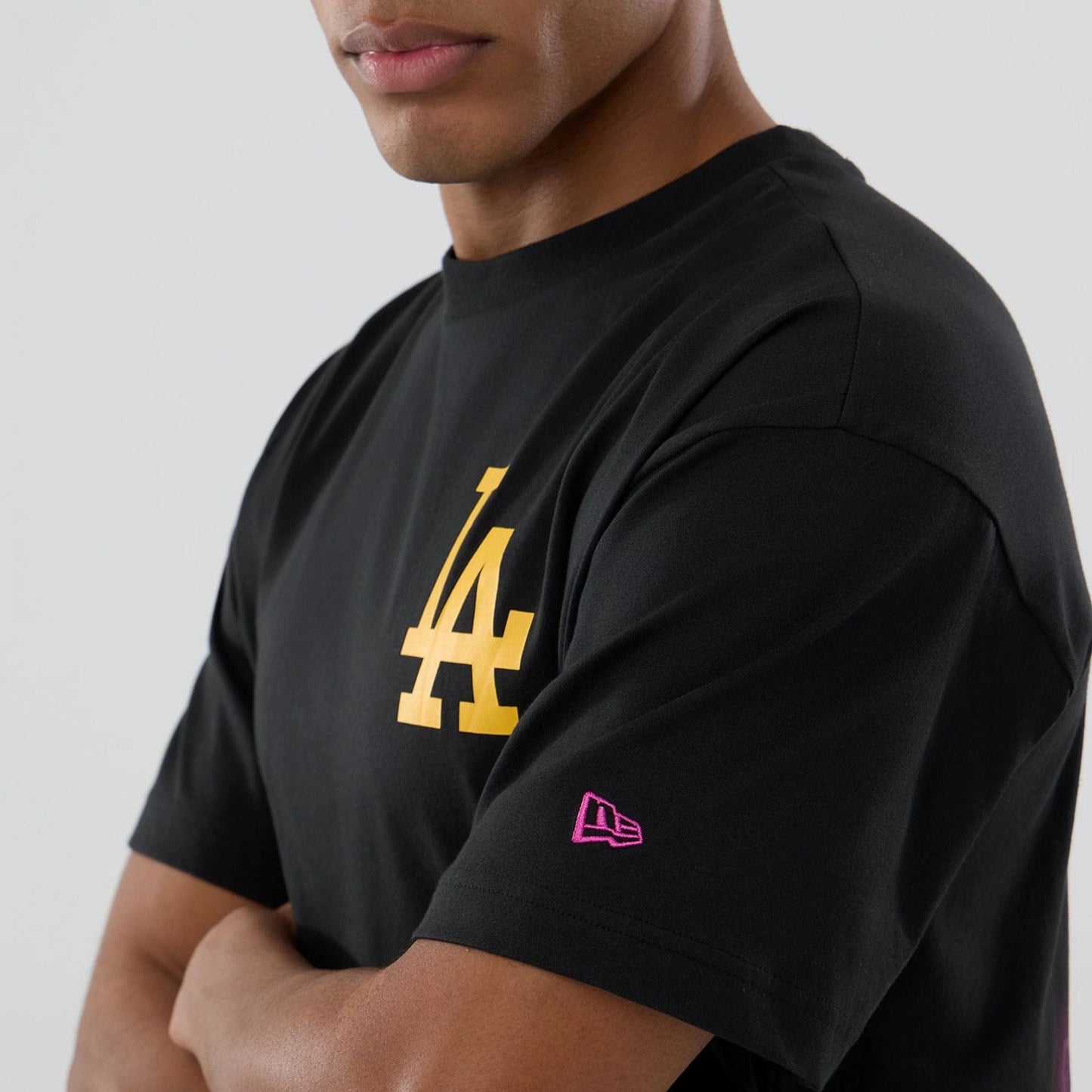 The model is wearing this MLB Neon Light LA Dodgers T-Shirt in black. 4