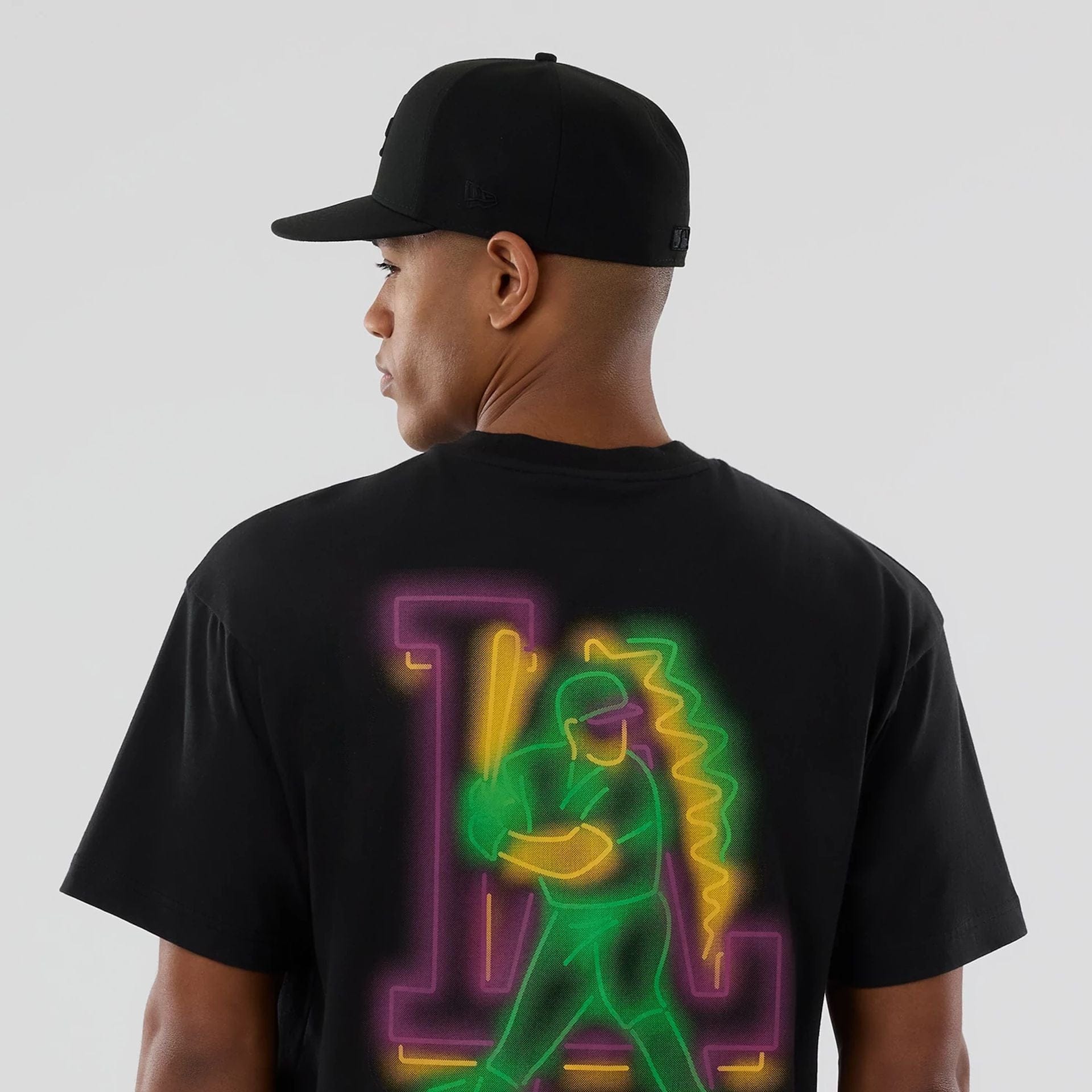 The model is wearing this MLB Neon Light LA Dodgers T-Shirt in black. 5