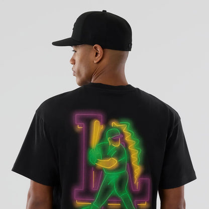 The model is wearing this MLB Neon Light LA Dodgers T-Shirt in black. 5