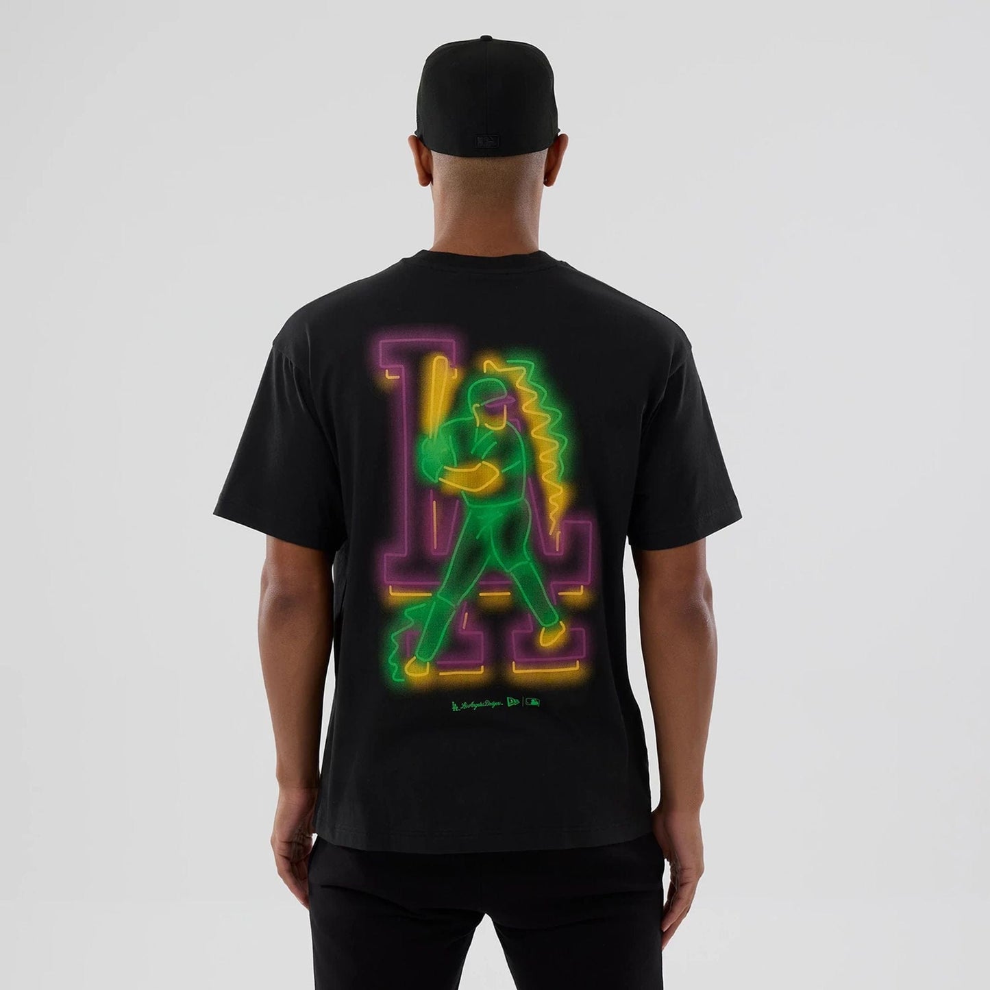 The model is wearing this MLB Neon Light LA Dodgers T-Shirt in black. 2