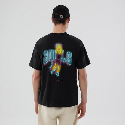The model is wearing this NBA Neon Light Chicago Bulls T-Shirt in black. 2