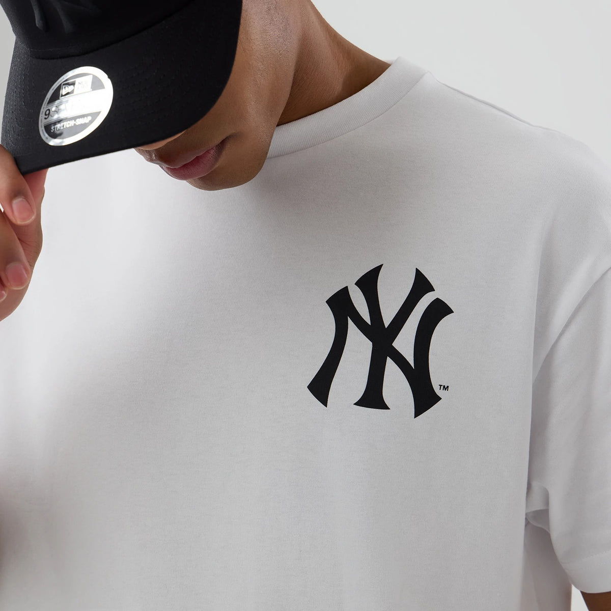 The model is wearing this MLB World New York Yankees T-Shirt in white. 6